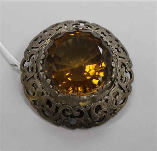 A large Victorian Scottish pierced silver mounted citrine brooch, 6.5cm.